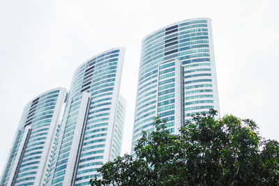 Low angle view of modern buildings against sky