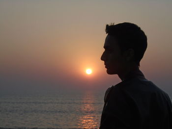 Silhouette of man at sunset