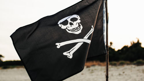 Low angle view of flag against sky