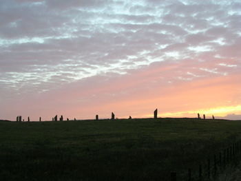 Scenic view of landscape against cloudy sky