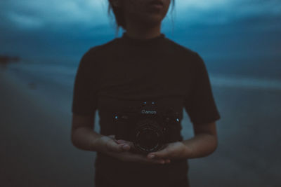 Midsection of man photographing