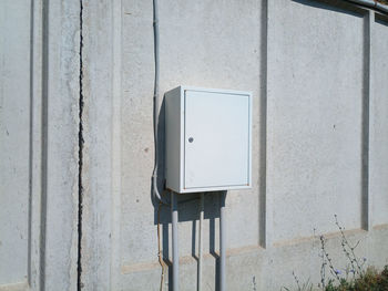 Close-up of telephone booth on wall