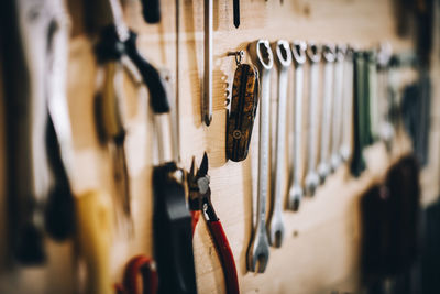 Close-up of clothes hanging on wall at store