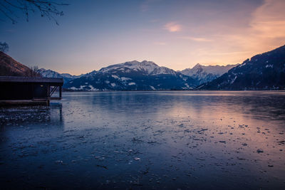 Scenic view of lake and mountains against sky