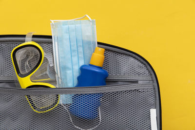 Close-up of yellow toy over white background