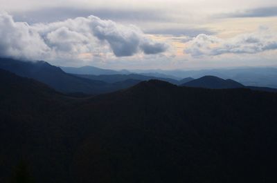 Scenic view of silhouette mountains against sky at sunset