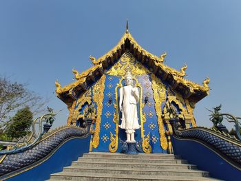 Low angle view of statue of building against sky