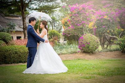 Couple standing in park