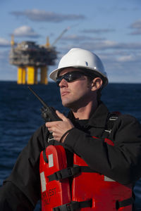 Offshore energy production with person on ship