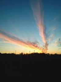 Silhouette trees against sky during sunset