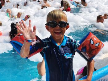 Portrait of smiling young man in swimming pool