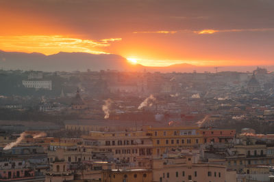 Cityscape against sky during sunset