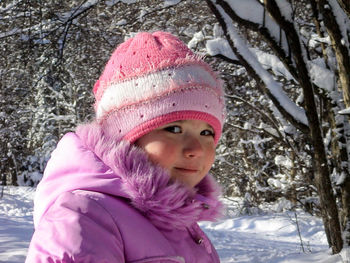 Portrait of smiling girl in snow