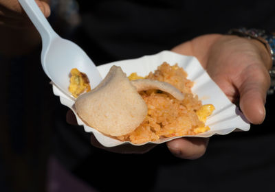Close-up of hand holding ice cream