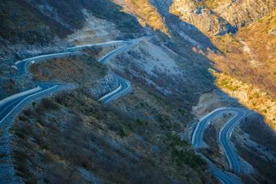 High angle view of road by mountain against sky