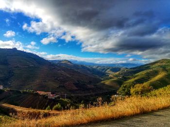 Scenic view of landscape and mountains against sky