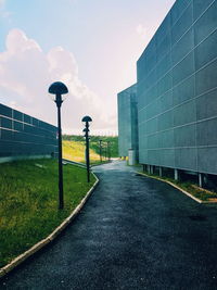 Street amidst buildings against sky in city