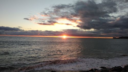 Scenic view of sea against sky during sunset