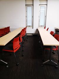 Empty chairs and tables in restaurant