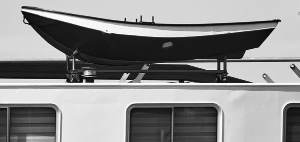 Lifeboat on the roof of a cargo ship for inland navigation, black and white