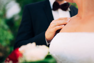 Midsection of man holding hands
