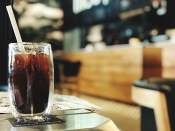 Close-up of coffee served on table at cafe