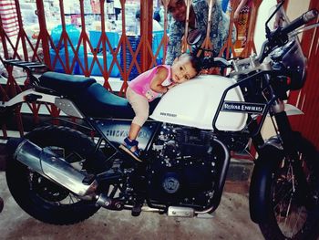 High angle portrait of woman sitting on motorcycle