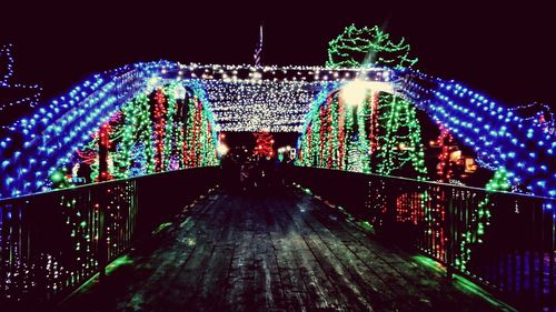 Illuminated walkway at night