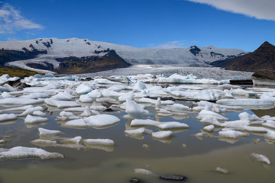 Ice floes floating in sea during winter
