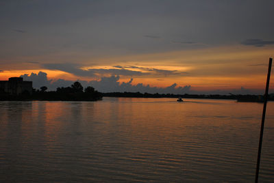 Scenic view of sea against sky at dusk