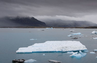 High angle view of iceberg in sea