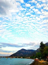 Scenic view of sea against cloudy sky