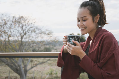 Young woman using mobile phone