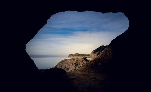 Scenic view of sea against cloudy sky