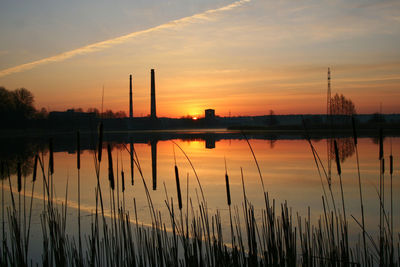 Scenic view of river against sky during sunrise