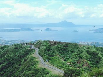 Mountain road against sea 