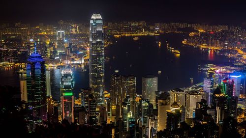 Aerial view of illuminated buildings in city at night