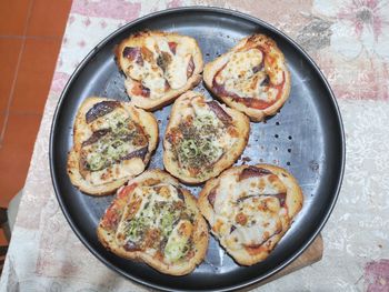 High angle view of pizza served on table