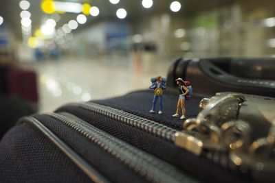 Miniature people while travelling