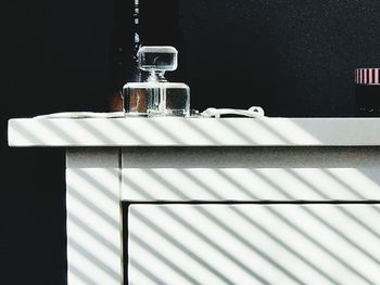 Close-up of glass bottle on table