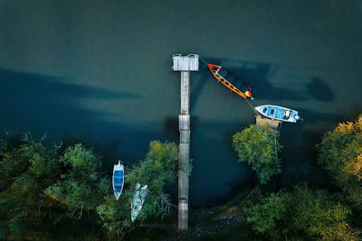 Aerial view of fishing boat by pier