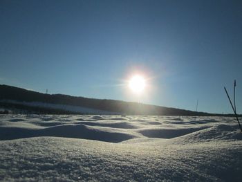 Sun shining over landscape