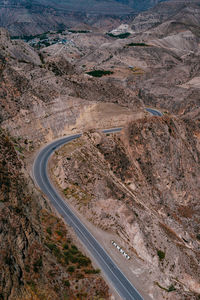 High angle view of tire tracks on road