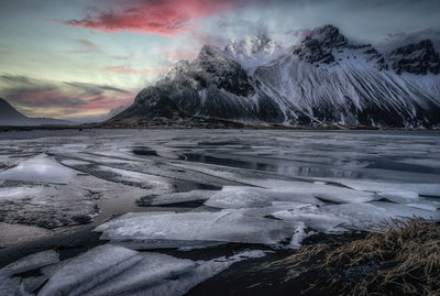 Scenic view of snowcapped mountains against sky during winter