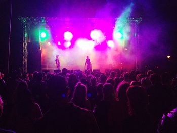 People enjoying music concert