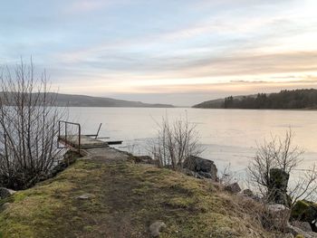 Scenic view of lake against sky during sunset