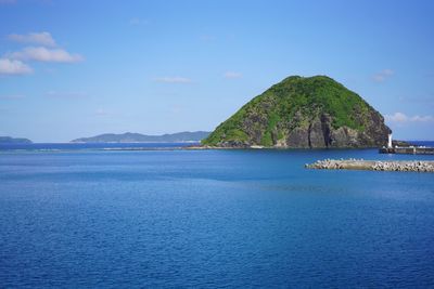 Scenic view of sea against blue sky