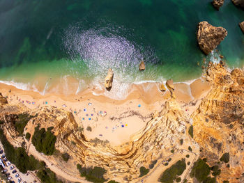 High angle view of rocks in sea