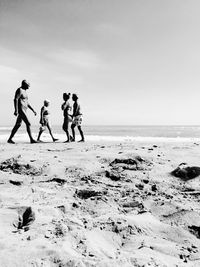 People walking on beach