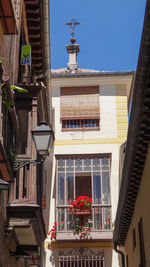 Low angle view of buildings in city against sky